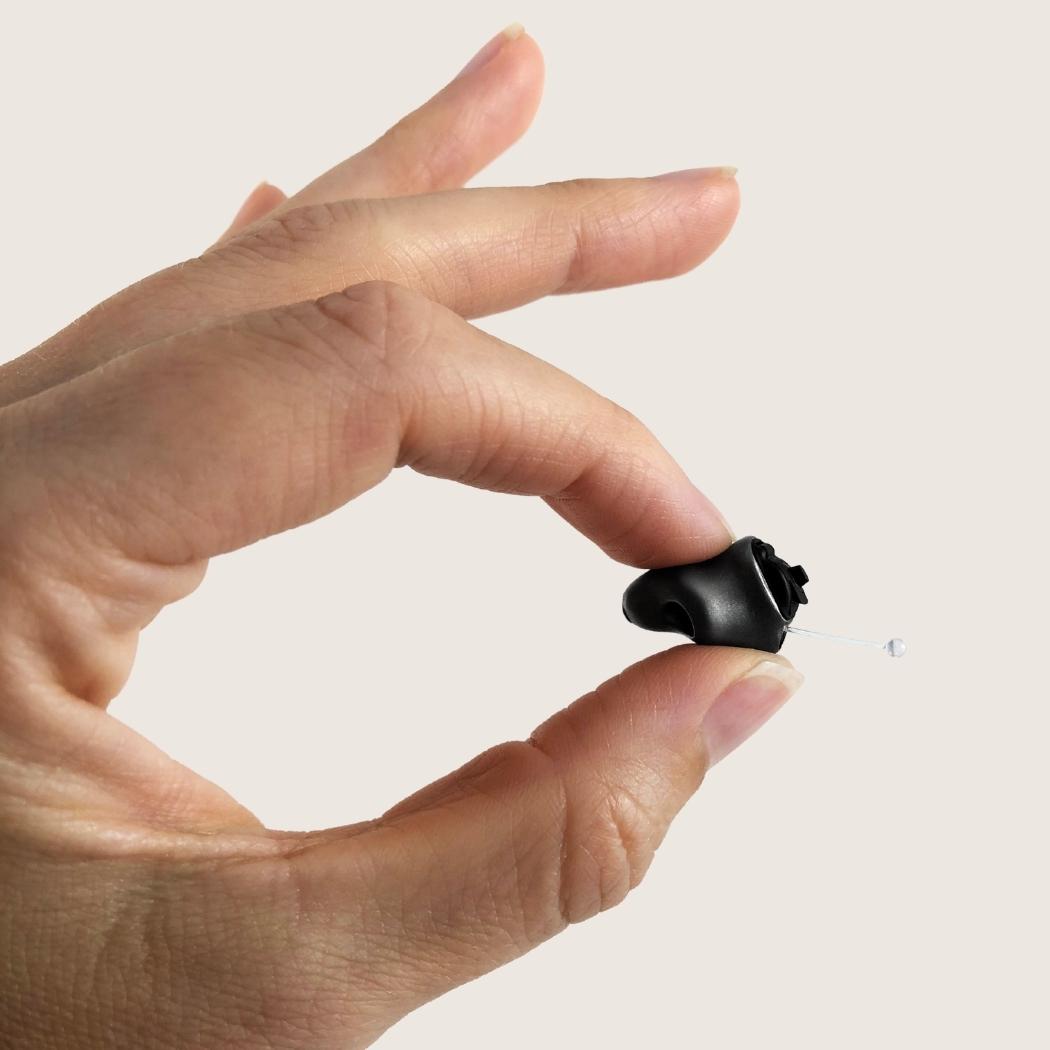 Image of Phonak custom hearing aids held in someones hand