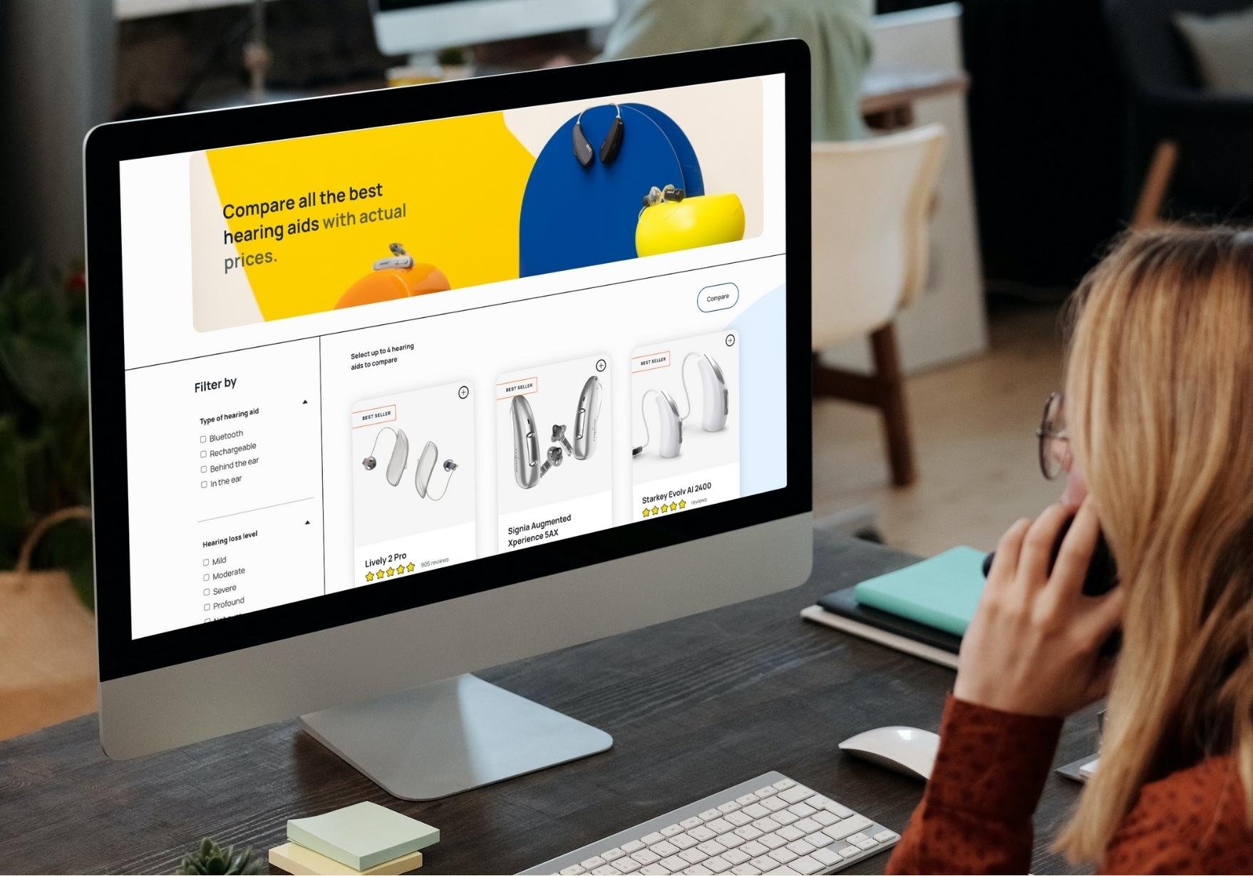 Image of woman using Soundly.com to compare hearing aids