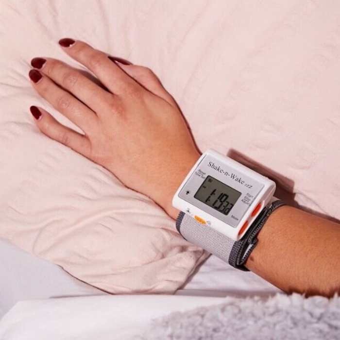 Woman wearing a vibrating alarm clock